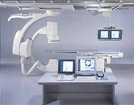 X-ray equipment is mounted on a C-shaped gantry with the x-ray tube itself beneath the table on which the patient lies. Above the patient is an image intensifier that receives the x-ray signals, amplifies them, and sends them to a TV monitor.